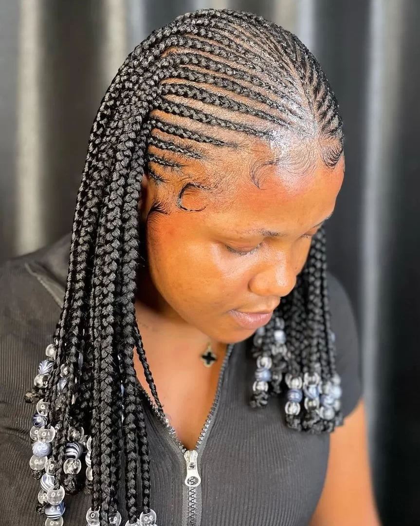 Shuku hairstyles with front Cornrows and beaded tips