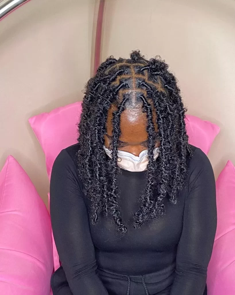Detailed view of the short dreadlocks above 