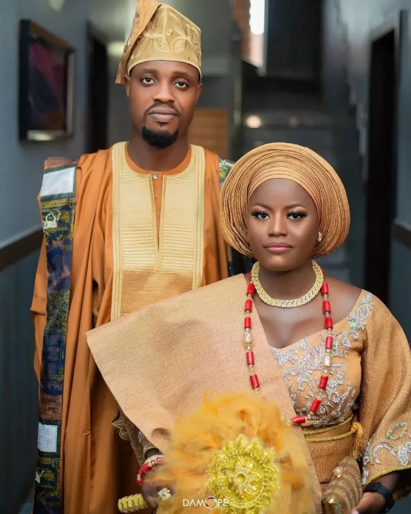 Gold traditional marriage attire for yoruba couples 