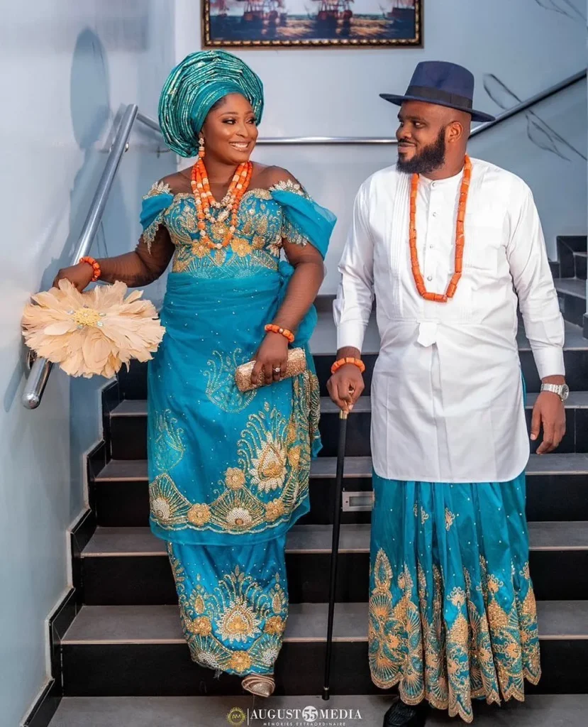 Stunning white shirt for itsekiri groom and green George Wrapper for the bride