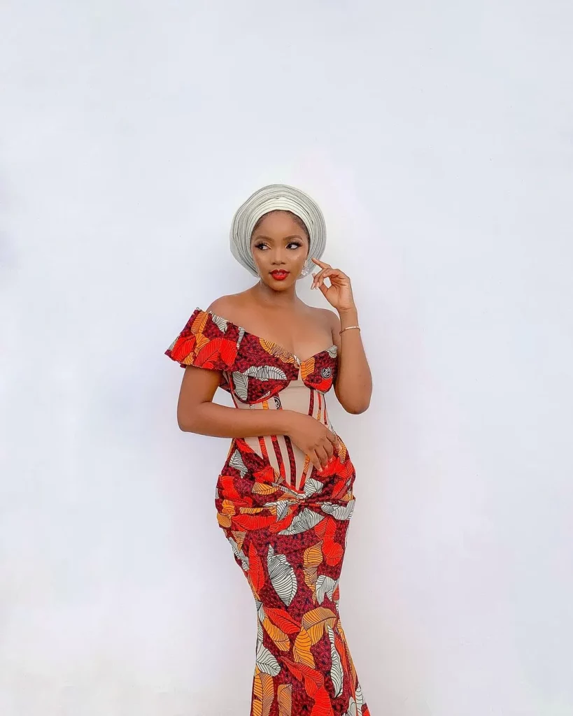 Ankara gown with corset, with a wrap tail and a lace at the back.