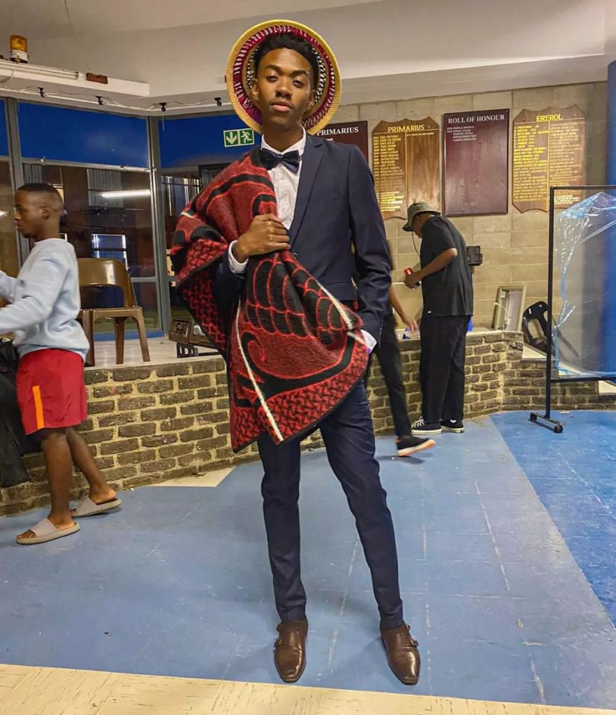 Sotho groom in Shweshwe inspired shirt, Basotho blanket and straw kobo hat