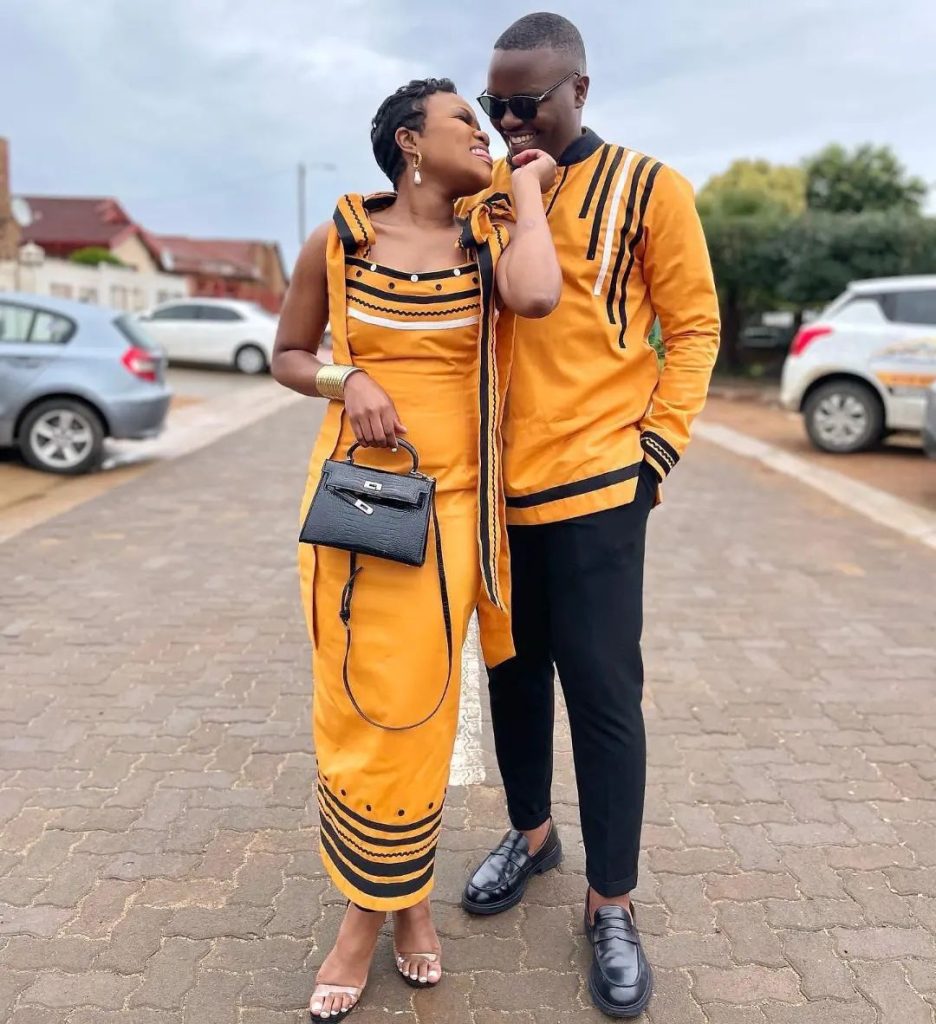 Couple In Beautiful Orange and Black Xhosa Umbhaco Traditional Attire