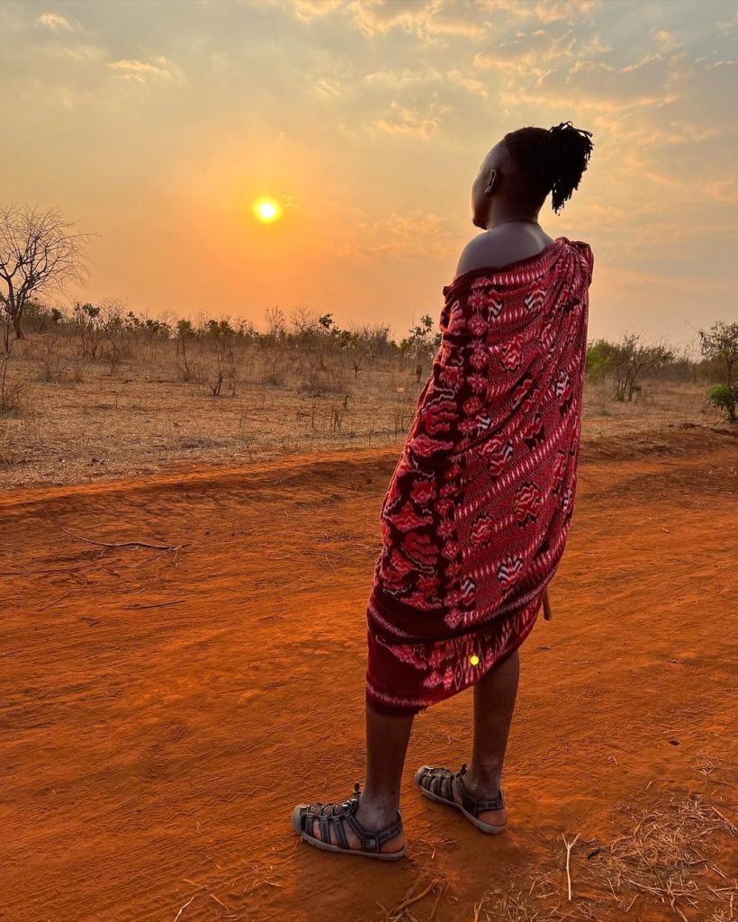 Most Maasai wear the color red because it symbolizes their culture and they believe it scares wild animals away