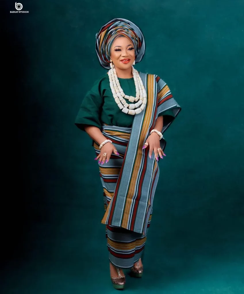 A woman wearing iro and buba (wrapper and loose blouse) 