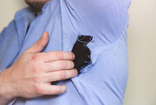 Man in Ripped shirt which need repairing and sewing