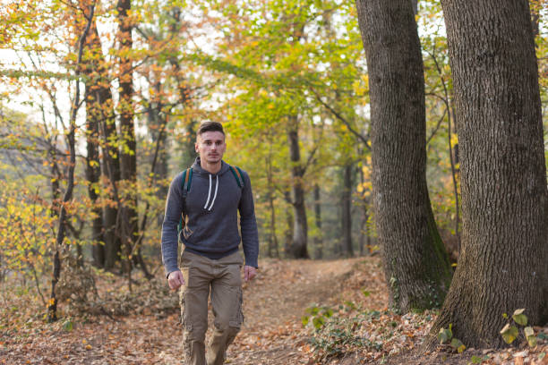 Young man enjoying his hiking during autumn