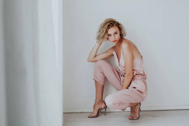 Pink satin top, pink paperbag pants, and strappy sandal heels