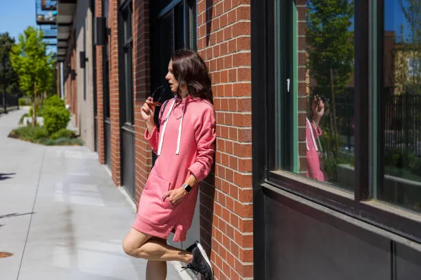 Rose pink sweater dress with black sneakers