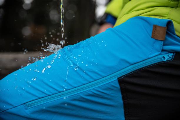 Hydrophobic effect on blue waterproof fabric trousers.
